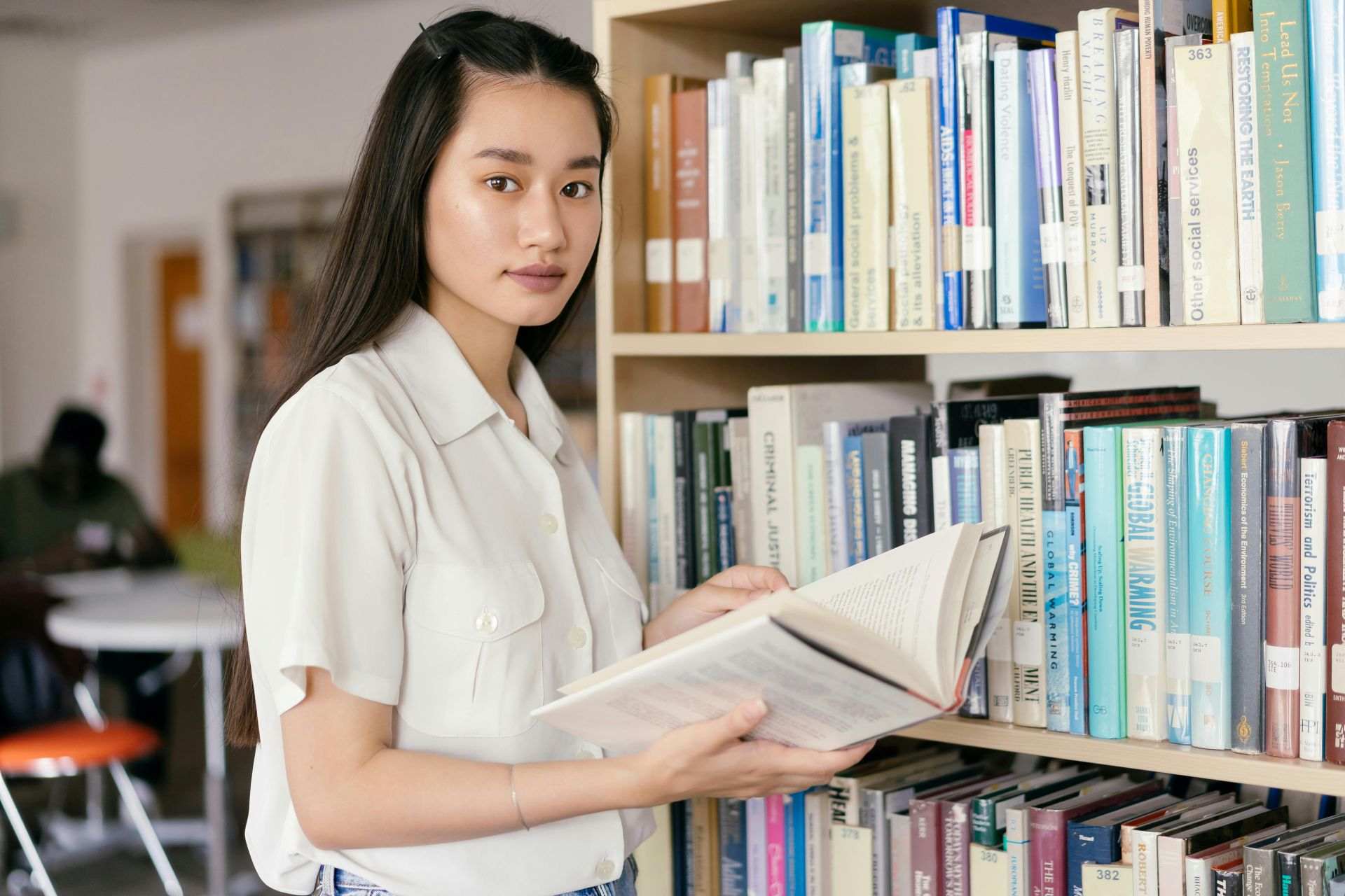 student taking a book