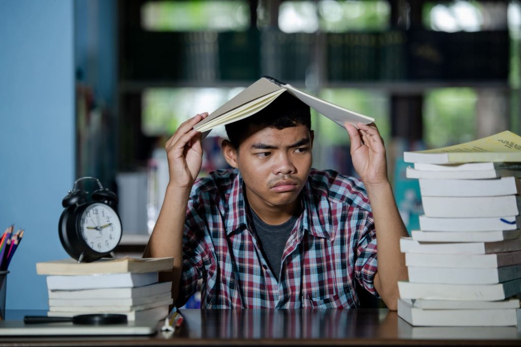 educational concept tired student library_