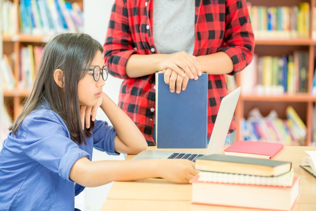 student studying school library_