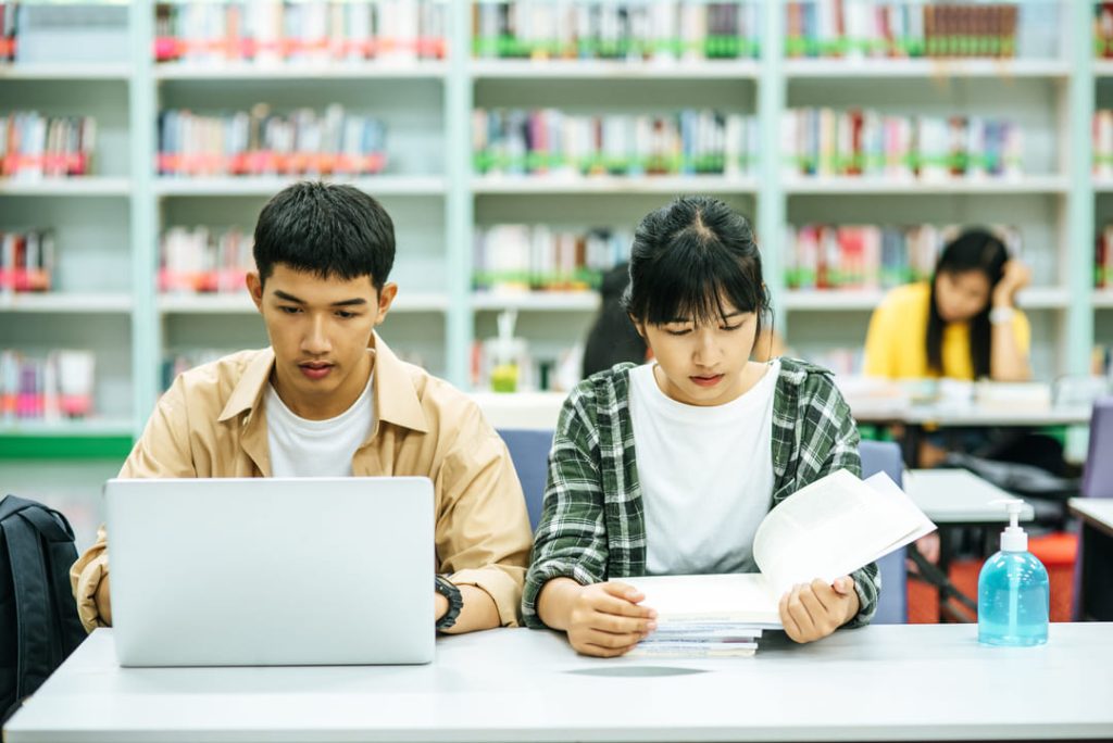 women-read-books-men-use-laptops-search-books-libraries