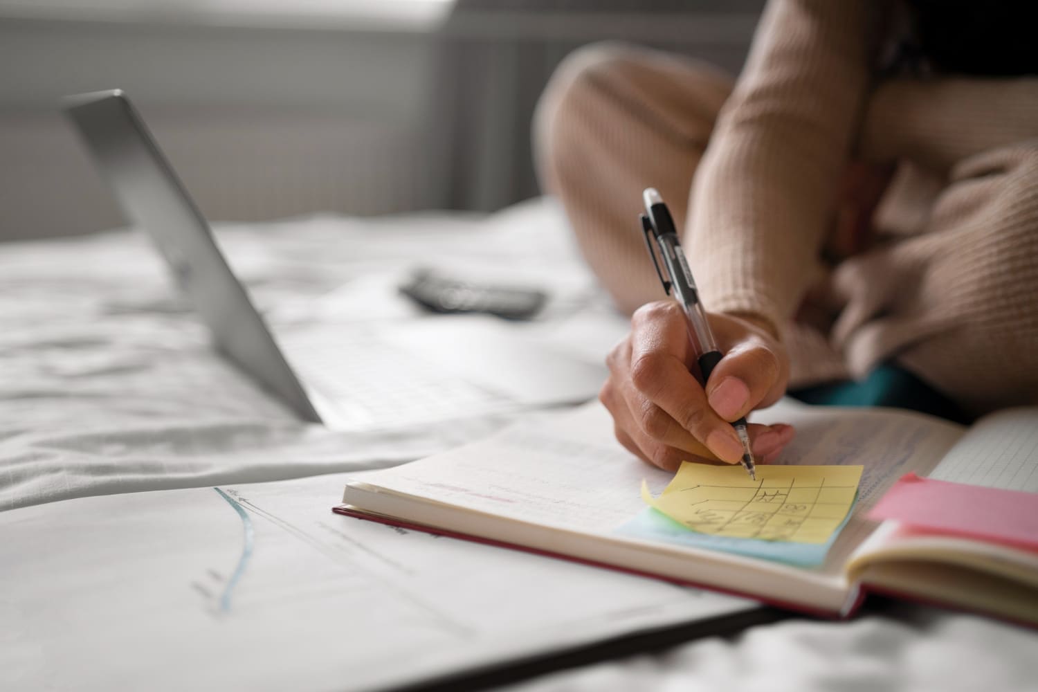 Woman writing in her notebook.